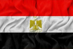 tyg vågig textur egyptens nationella flagga. foto