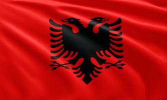 närbild viftar Albaniens flagga foto