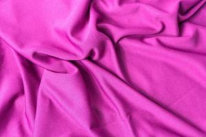 rosa tyg texturerad bakgrund. sport rosa kläder tyg jersey texturerat. foto
