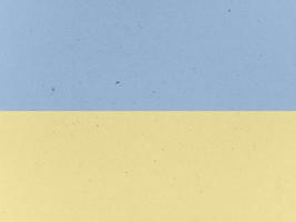 gammalt papper med prickig textur bakgrund. blå och gula färger. foto