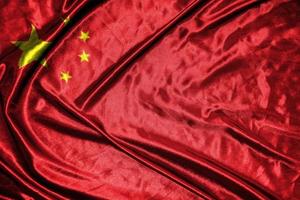 Kina tyg flagga satin flagga viftande tyg textur av flaggan foto