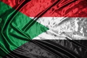 sudan tyg flagga satin flagga viftande tyg textur av flaggan foto