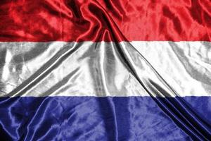 nederland tyg flagga satin flagga viftande tyg textur av flaggan foto