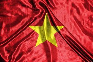 vietnam of america tyg flagga satin flagga viftande tyg textur av flaggan foto