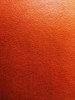 orange färg vägg slät yta textur material bakgrund papper konst kort ljus utrymme abstrakt bakgrund banner tom och ren klar för ram design dekorationsbräda, loft stil cement betong foto
