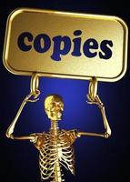 kopierar ord och gyllene skelett foto