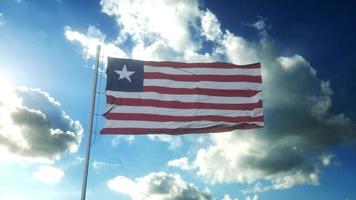 liberias flagga vajar i vinden mot vacker blå himmel. 3d-rendering foto