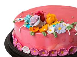 närbild bild tårta jordgubbssylt dekorationer med glasyr frukter foto