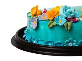 närbild blå ocean sylt tårta dekorationer med färgglada glasyr frukter foto