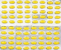 full ram av ovala gula tabletter piller i blisterförpackningar. gula piller mönster tapet. mefenaminsyra tabletter piller mot smärta, mensvärk, huvudvärk och tandvärk. foto