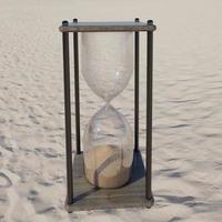 timglas 3d-rendering på sanden foto