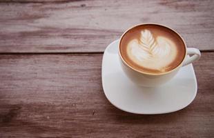 kopp art latte eller cappuccino med retro filtereffekt foto