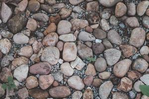 stenar arrangerade på marken för bakgrunden foto