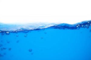 ytan av blått vatten som stänker eller rör sig foto