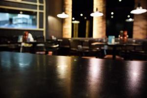 abstrakt oskärpa kaférestaurang med abstrakt bokeh ljus defokuserad bakgrund foto
