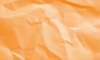 orange färgade skrynkliga papper textur bakgrund för design, dekorativa. foto