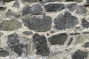 grå stenstruktur, murverk av naturstenar foto