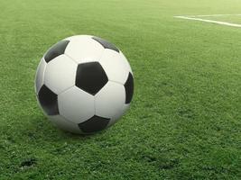 närbild fotboll på grönt gräs foto