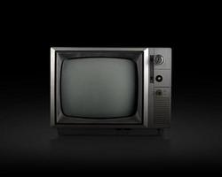 retro gammal tv på svart bakgrund foto