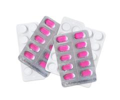 paket med rosa piller. apotek och medicin koncept foto