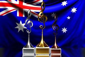 G-klav-priser för att vinna musikpriset mot bakgrund av Australiens nationella flagga foto