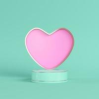 rosa hjärta i metallram med cylindrisk postament ljusgrön bakgrund i pastellfärger. foto