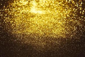 gyllene glitter bokeh belysning textur suddig abstrakt bakgrund för födelsedag, årsdag, bröllop, nyårsafton eller jul foto