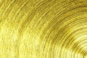 ett metall guld järn med cirkulär textur bakgrund foto
