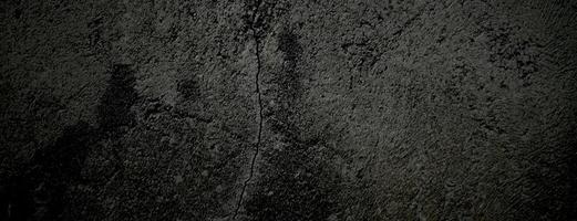 svart sten betong textur bakgrund. mörkgrå svart cement för bakgrund. foto