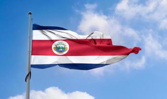 costa rica flagga - realistisk viftande tygflagga. foto