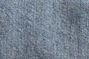 material i blått jeanstyg foto