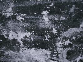 svart och vit bakgrund, grov textur, ser ut som ett cementgolv för bakgrund eller reklamtext. foto