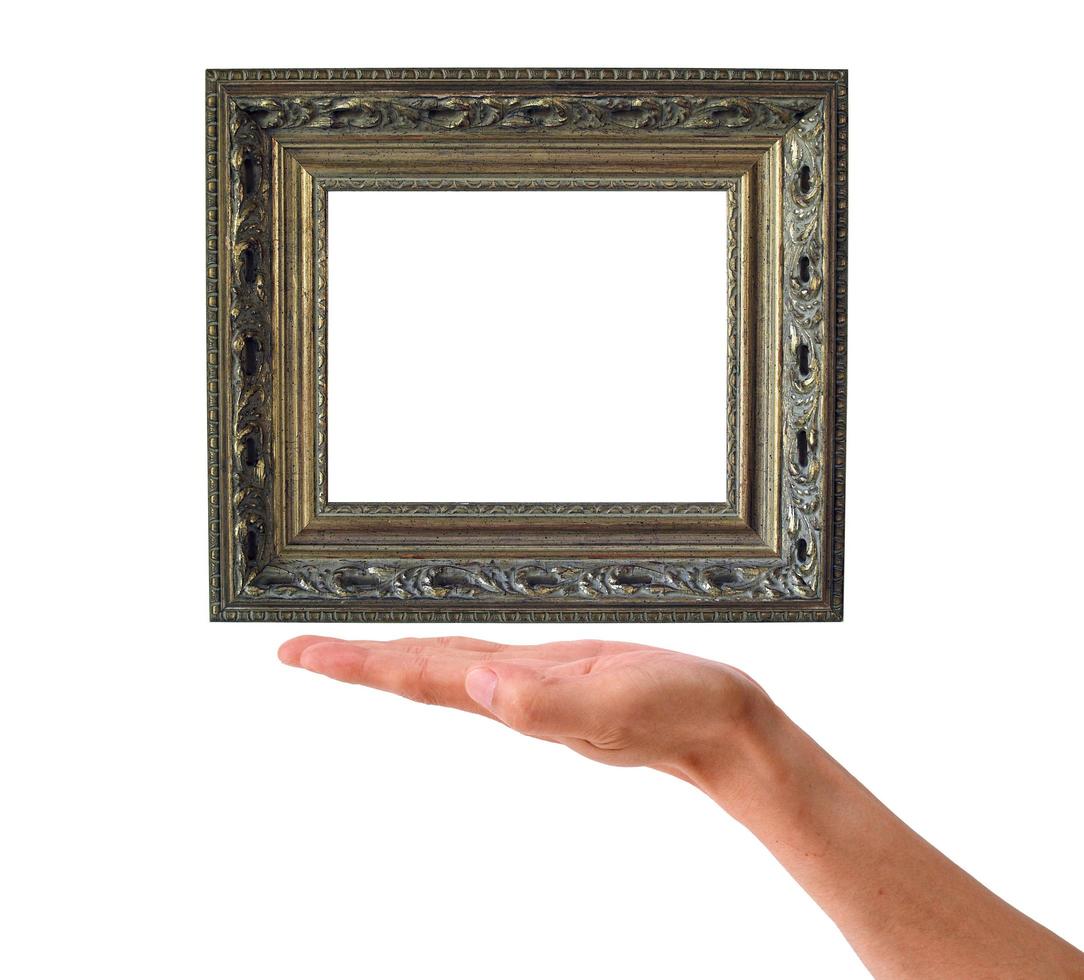 houten kader in een hand op een witte achtergrond foto