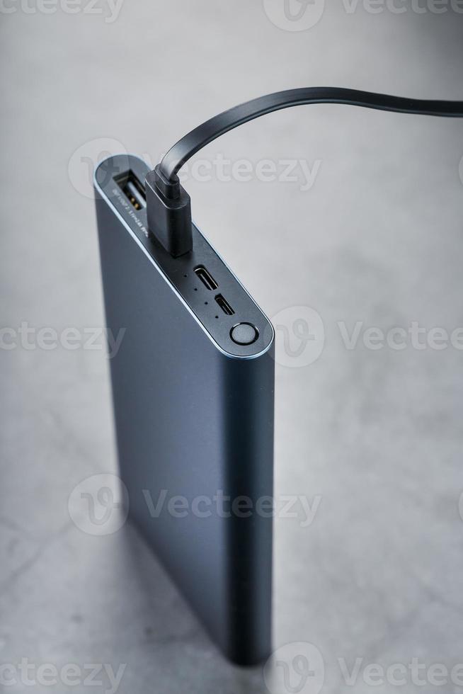 portable extern accu macht bank blauw met USB koord foto