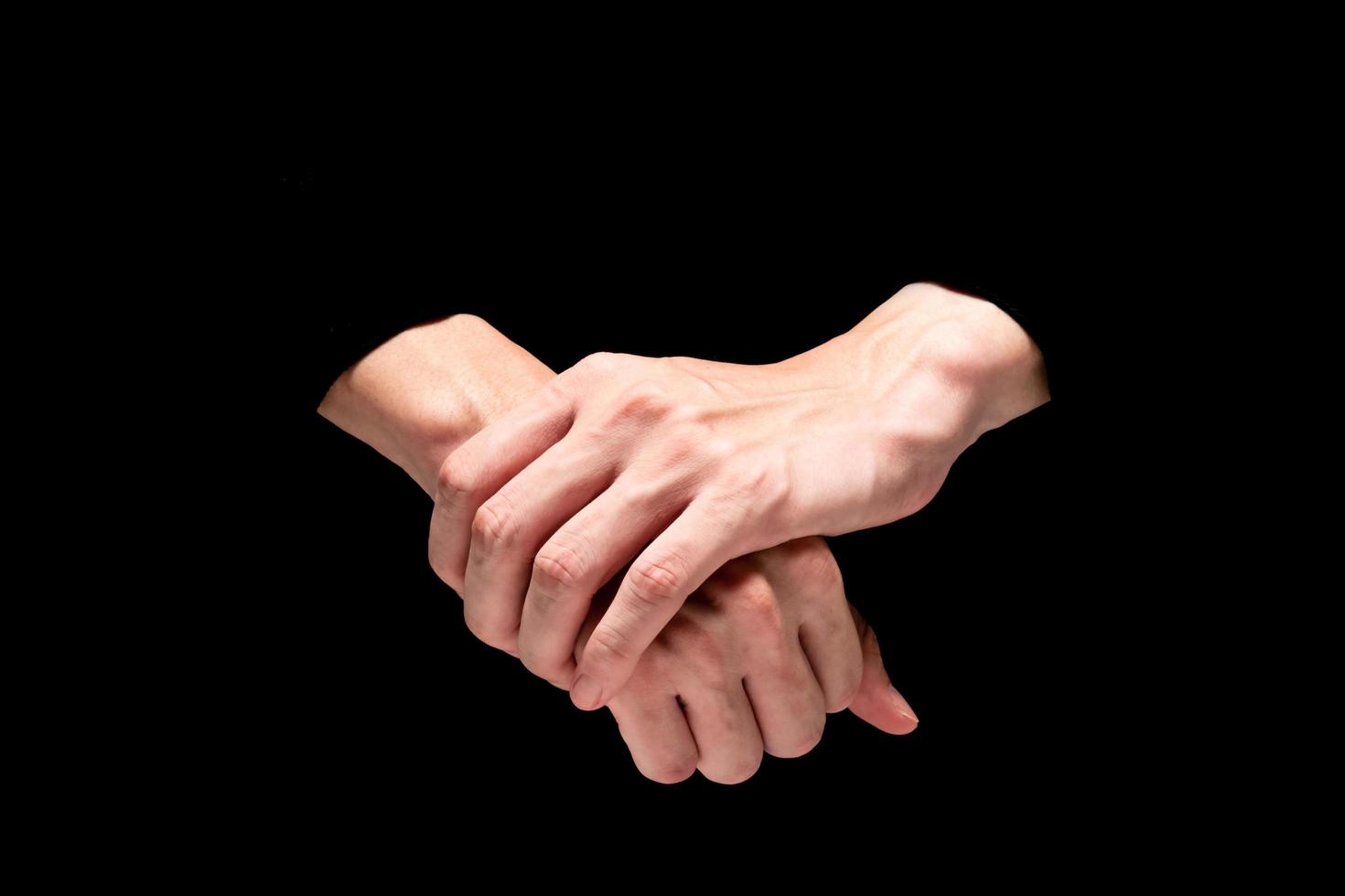 mannetje handen Aan een zwart achtergrond. foto