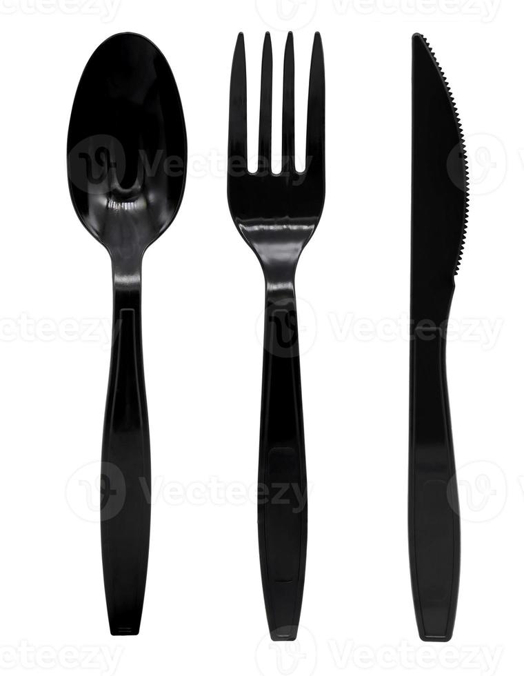 zwart plastic lepel vork en mes geïsoleerd Aan wit achtergrond foto