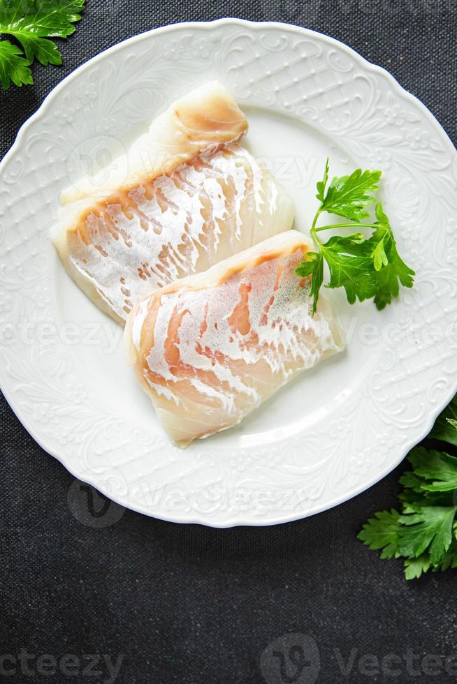 kabeljauw vis wit filet vers maaltijd voedsel tussendoortje Aan de tafel kopiëren ruimte voedsel achtergrond foto