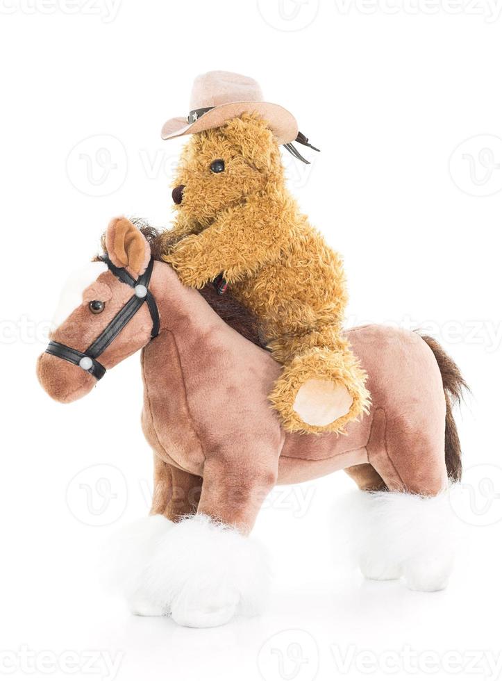 cowboy teddy beer rijden een paard foto