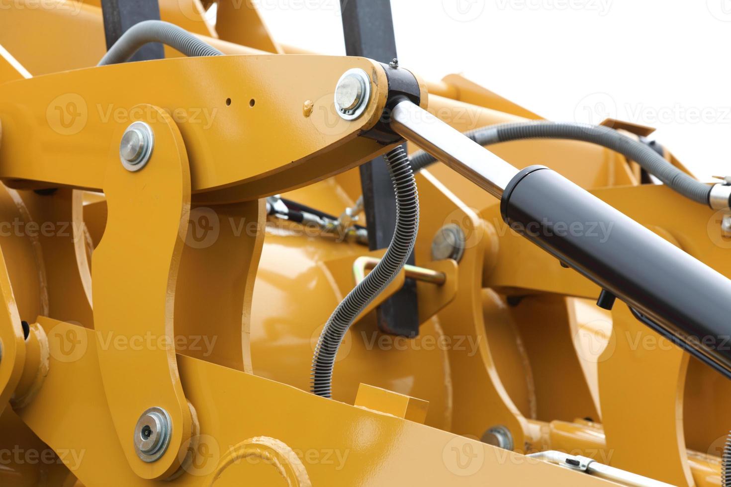 detail van hydraulische bulldozer witte achtergrond foto
