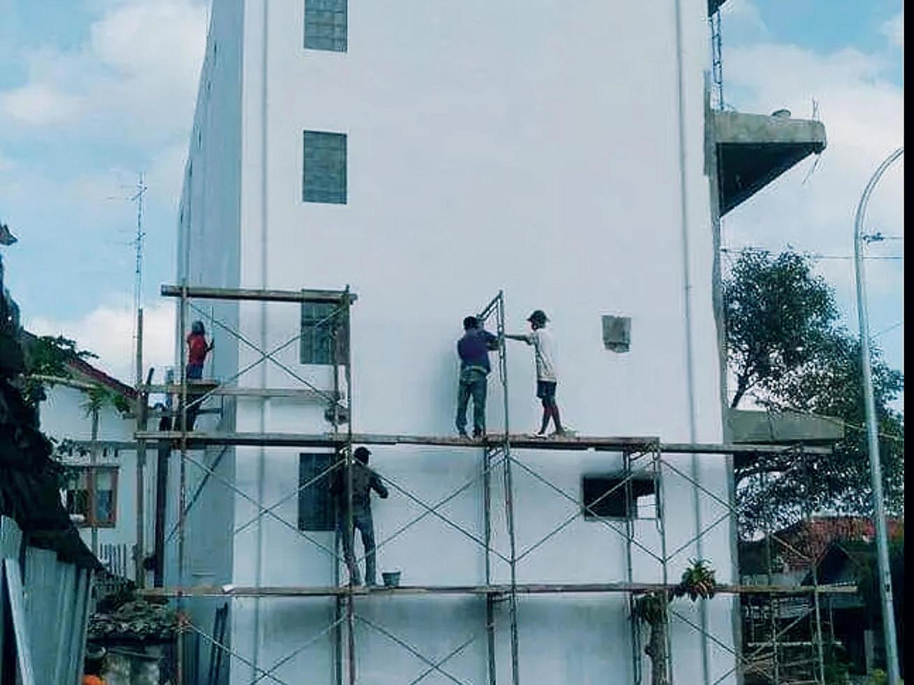 padang, Indonesië, 2022 - gebouw vernieuwing werkwijze foto