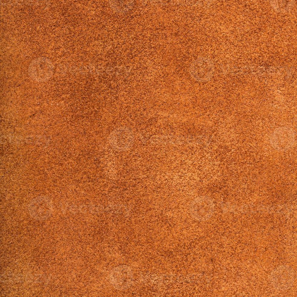 achtergrond van donker oranje suede dichtbij omhoog foto