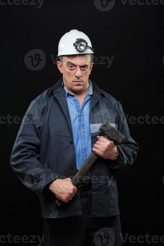 mijnwerker met een voorhamer foto
