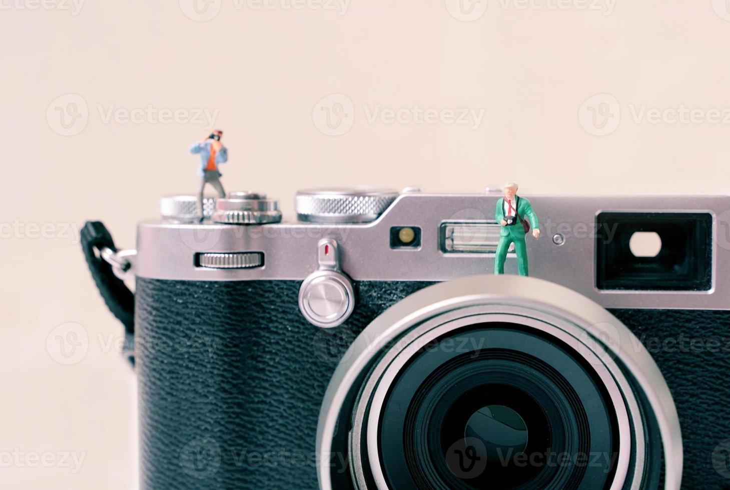 miniatuur groep van mensen fotograaf figuren met camera, kunst fotografie concept foto