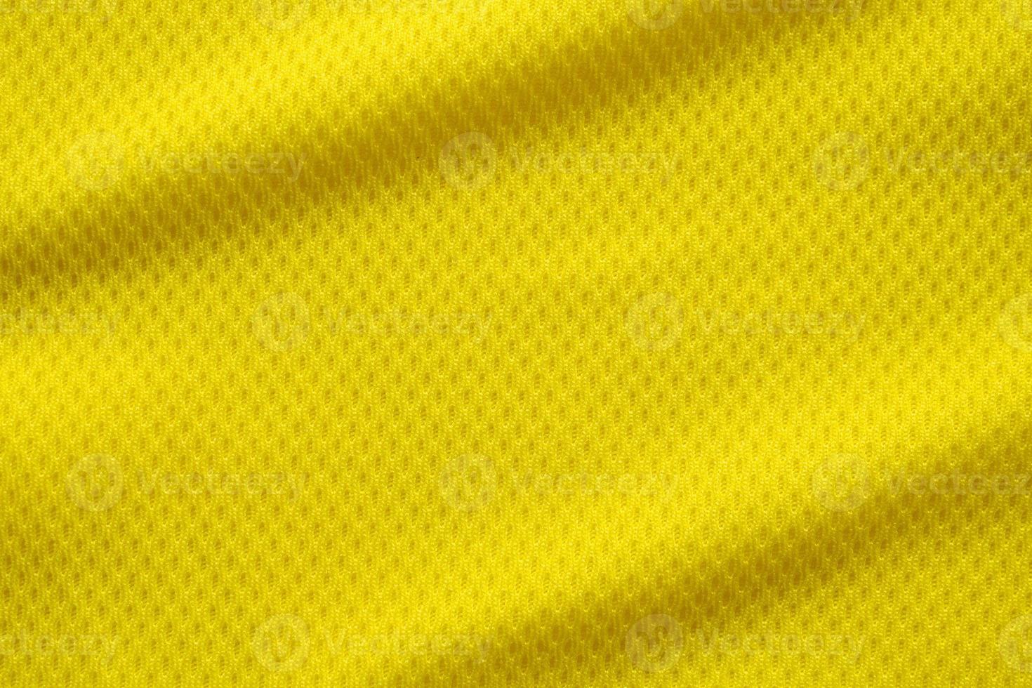 gele kleur voetbaltrui kleding stof textuur sportkleding achtergrond, close-up foto