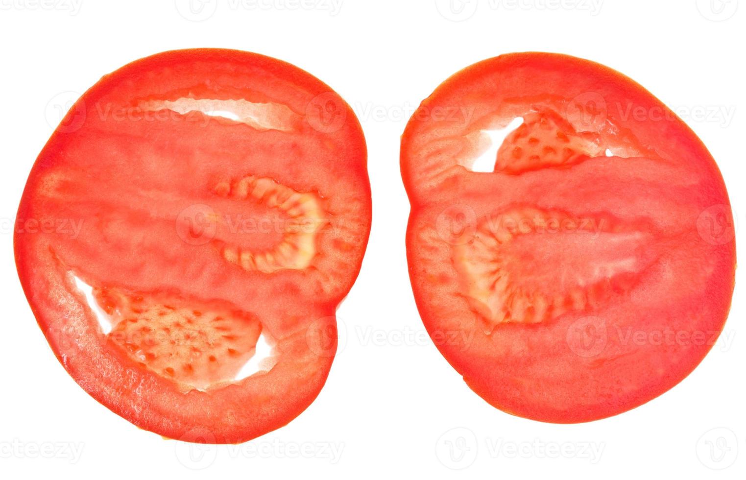 twee plakjes rood tomaat foto