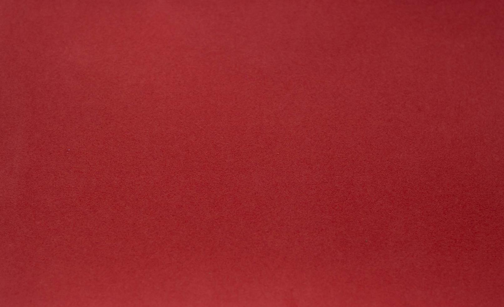 een wijnoogst rood achtergrond met een kriskras maas patroon en grunge vlekken foto
