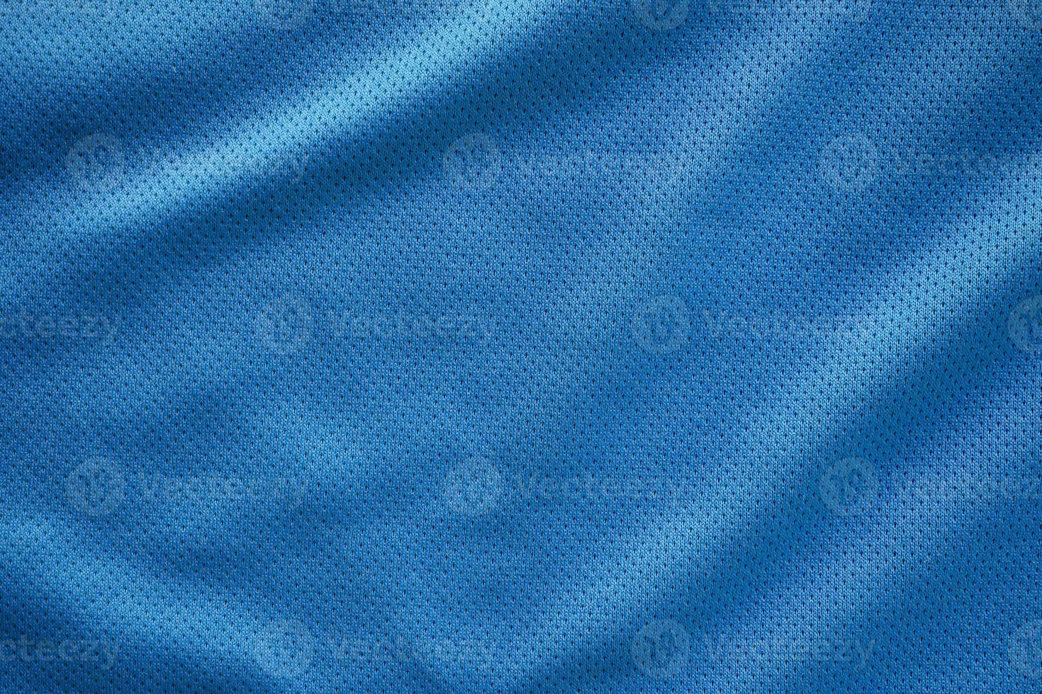 blauwe stof sportkleding voetbaltrui met luchtgaas textuur achtergrond foto