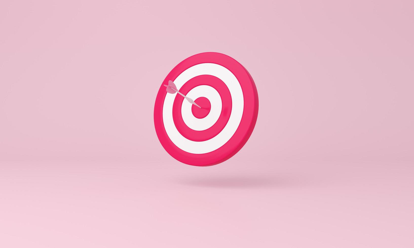 pijl raken de centrum van doelwit Aan roze achtergrond. bedrijf het richten Bij de doelwit concept. foto