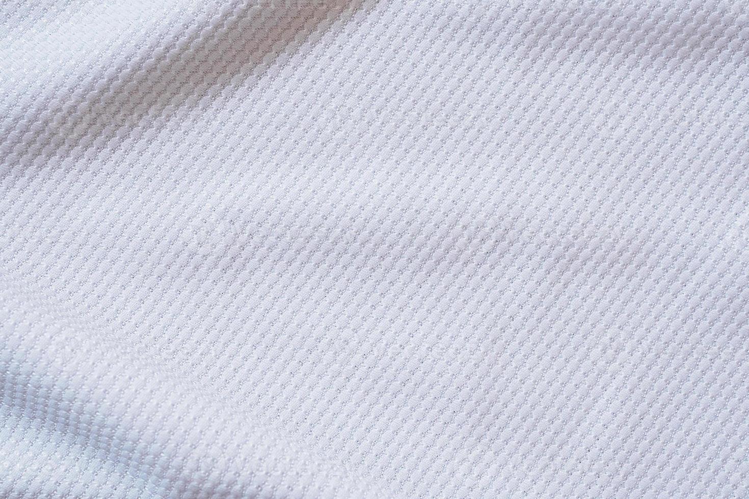 witte voetbaltrui kleding stof textuur sportkleding achtergrond foto