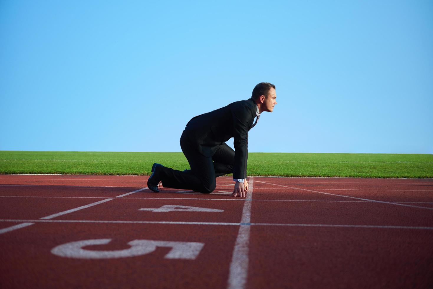 bedrijf Mens klaar naar sprint foto